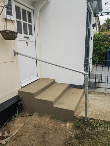 Create a new three steps stairs and a new hand rail on the front door